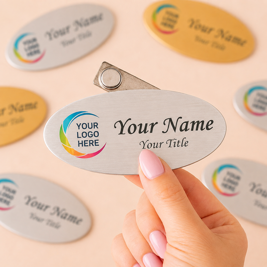 Personalized oval name tags in silver and gold with logo, name and title