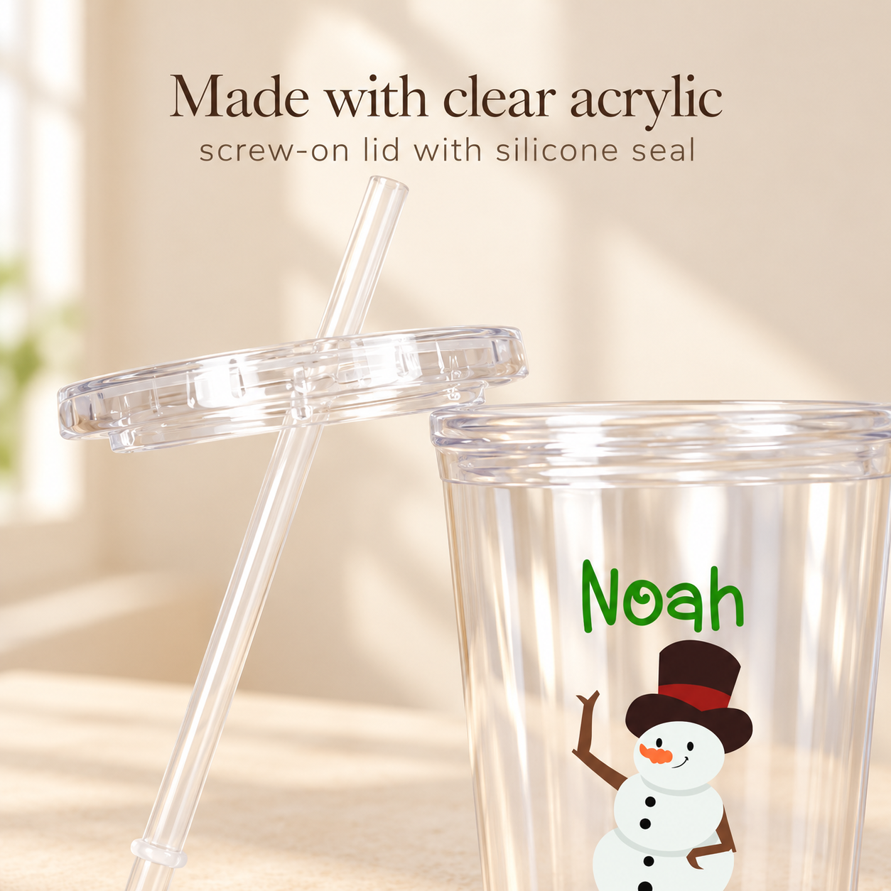 Clear acrylic kids tumbler with snowman and name Noah, screw-on lid and reusable straw