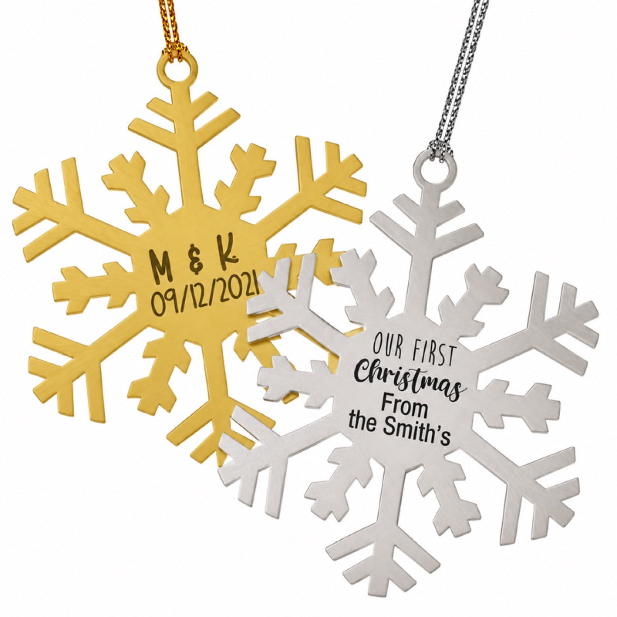 Gold snowflake ornament engraved with couple initials and wedding date and silver Our First Christmas snowflake ornament
