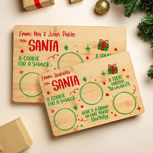 Two personalized Santa cookie trays in bamboo with kids names, small and large